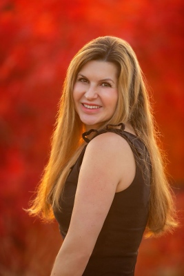 Melissa Headshot Red Background.jpeg